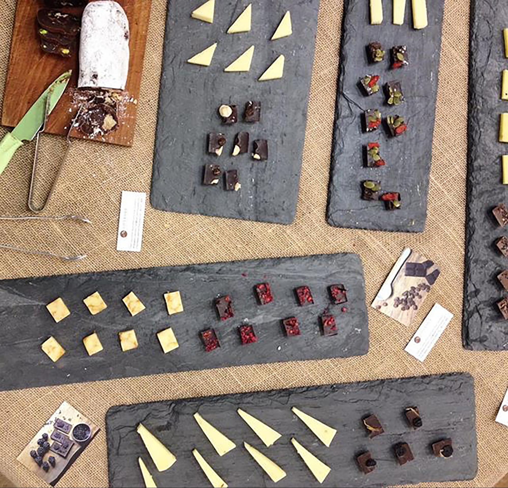 slate platters filled with chocolates and cheese