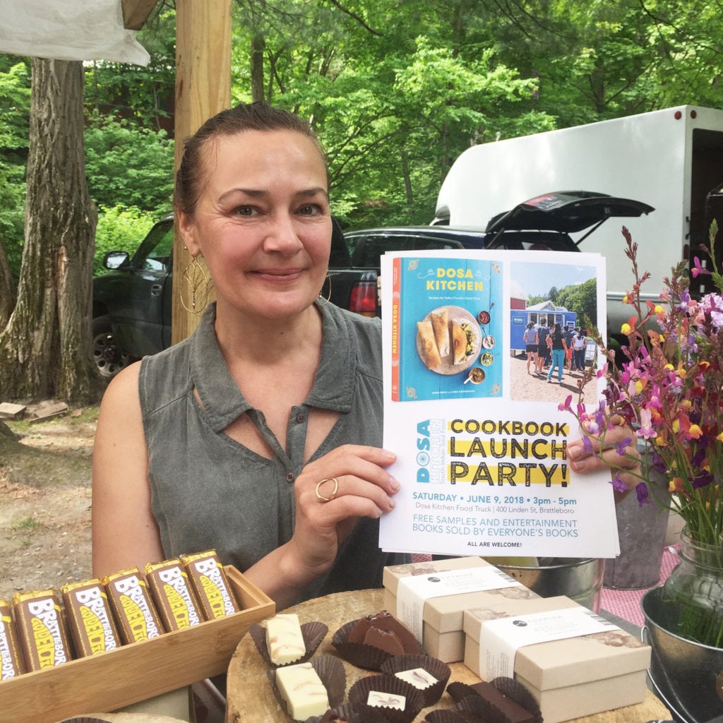 dar tavernier holding the dosa cookbook launch party flyer