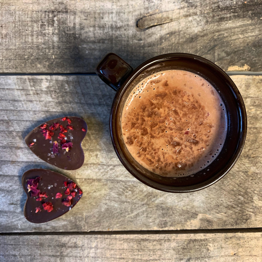 heart shaped mendiants and mug of hot chocolate