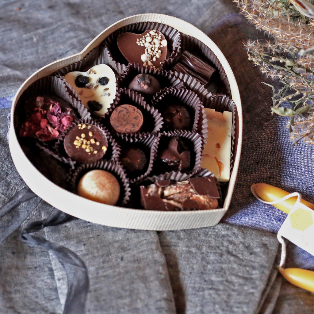 Small heart-shaped box filled with heart shaped chocolates and other Tavernier bonbons