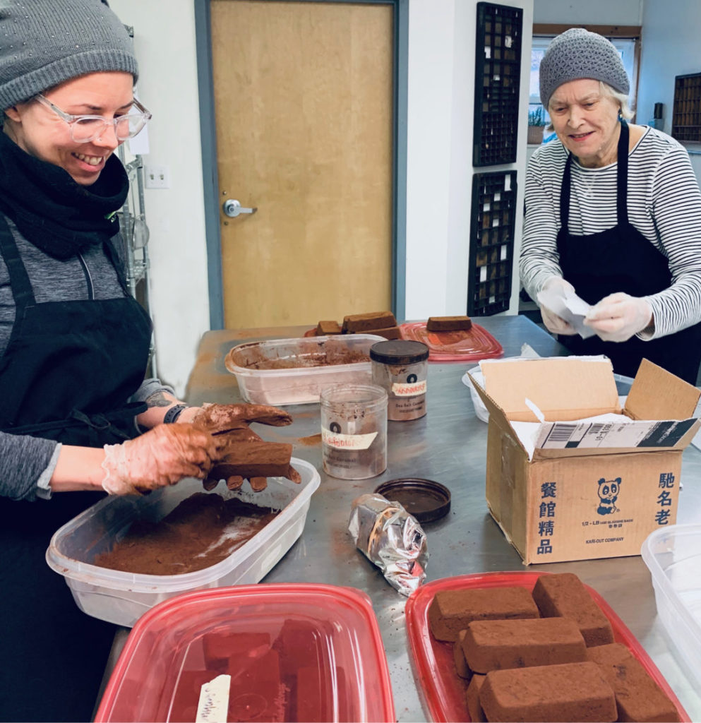 Tavernier Chocolates holiday chocolate helpers in action