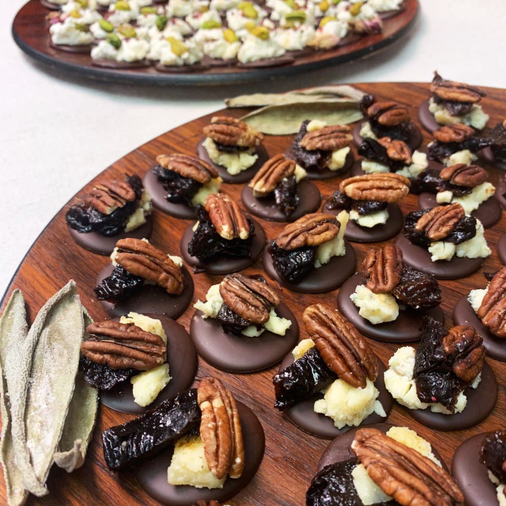 Wooden platters of chocolate and cheese canapes