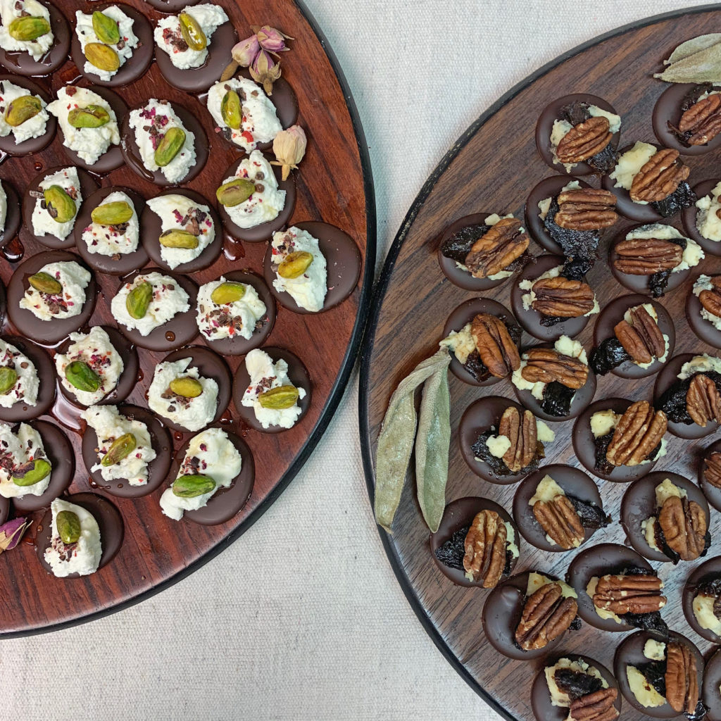 Wooden platters featuring Tavernier's chocolate and cheese canapes.