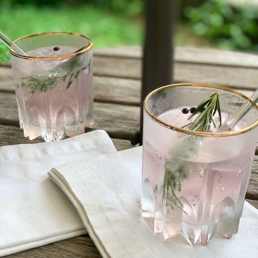 Two summer cocktails with rosemary and peppercorns