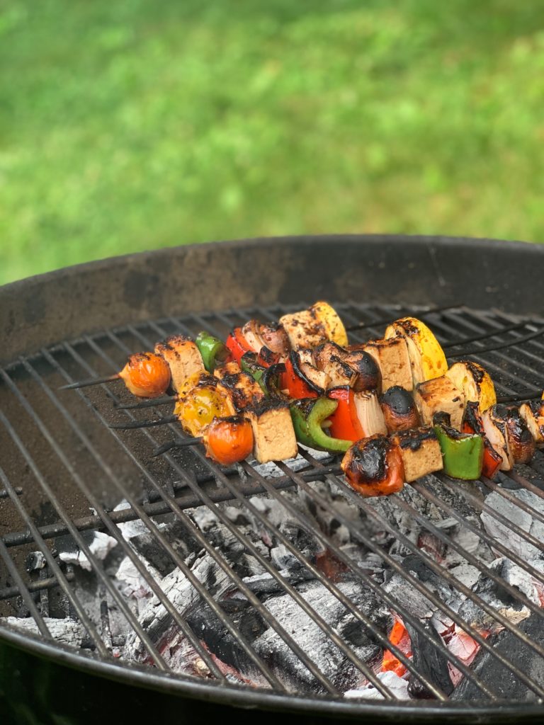 Kababs being grilled over charcoal