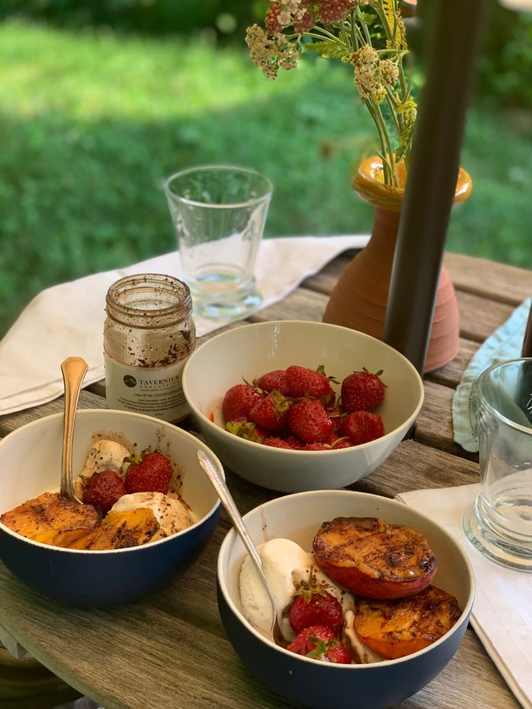 bowls of strawberries and grilled peaches and cream