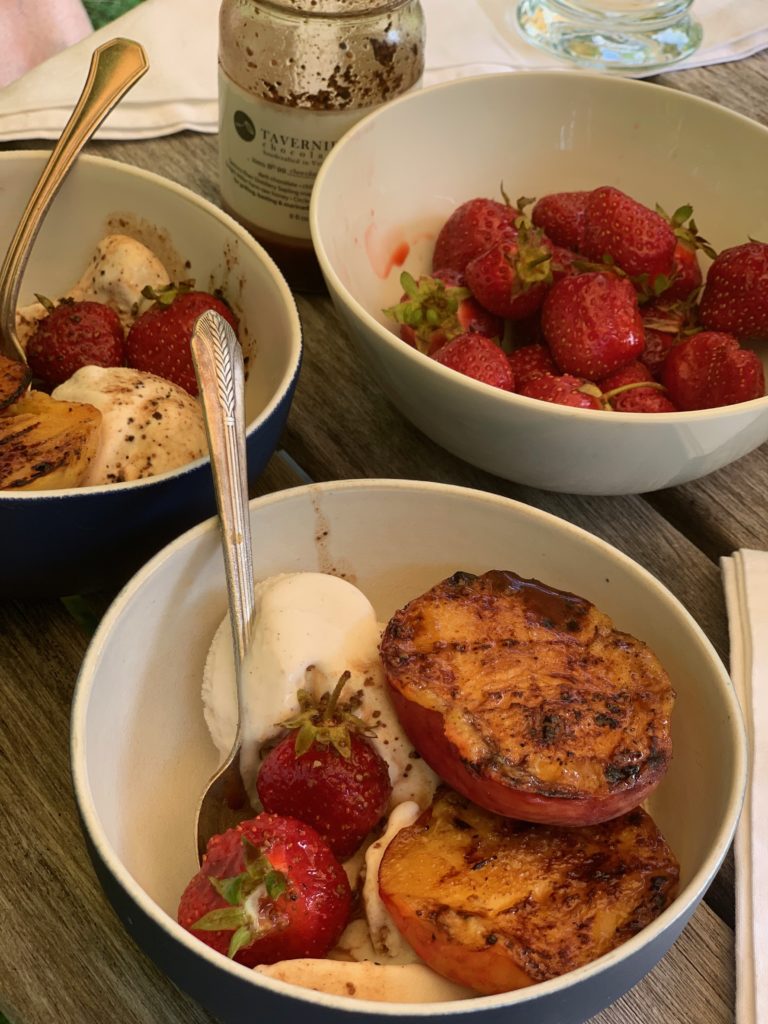 bowls of strawberries and grilled peaches and cream