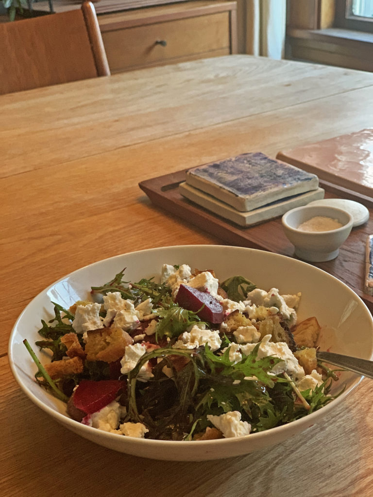 Bowl filled with beet and goat cheese salad