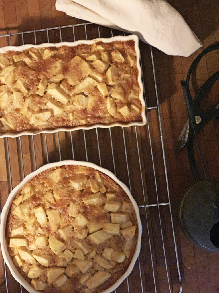 French apple cake fresh out of the oven on the cooling rack