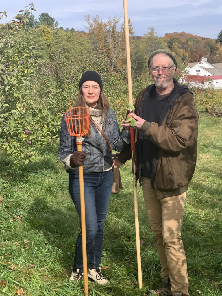 Dar and John Singer Using Equipment to Pick Apples at the orchard