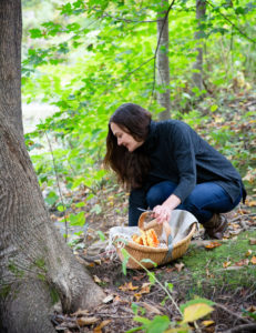 Dar Singer of Tavernier Chocolates foraging for mushrooms in the woods