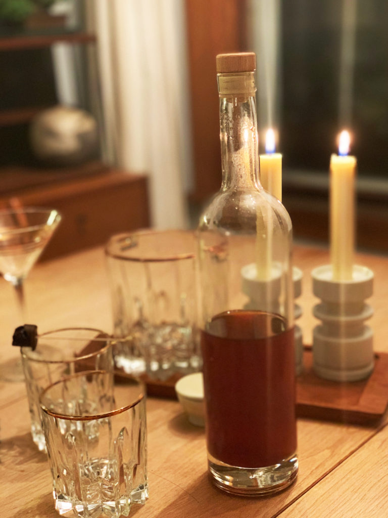 Liquor bottle with two empty glasses