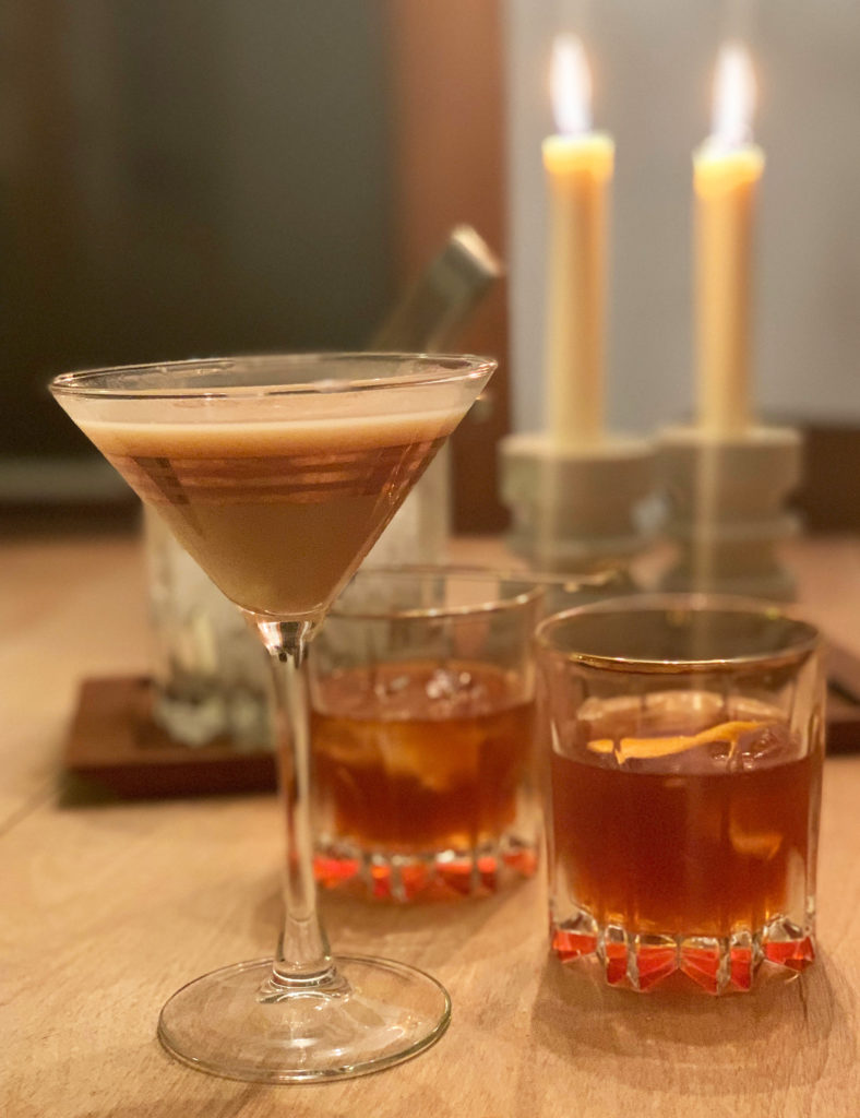 Spiced creme de cacao cocktails. One is in a martini glass and two are in whiskey glasses