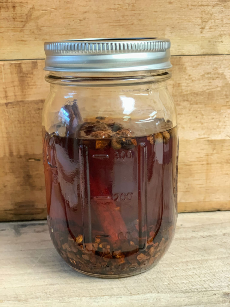 mason jar filled with cinnamon and spices