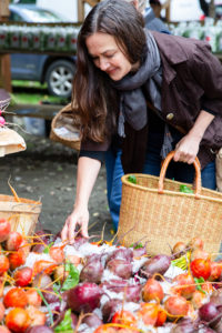 Dar Singer at the market picking out fresh beets.