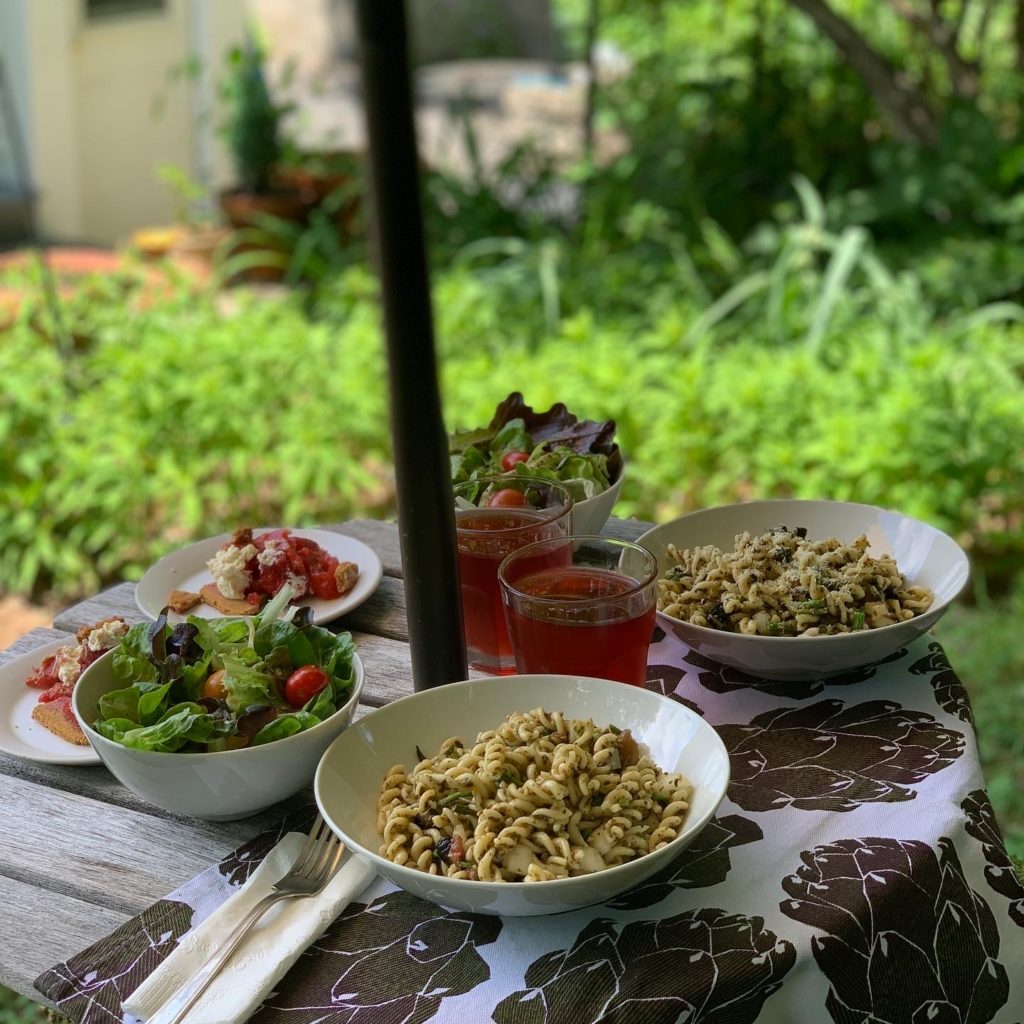 Outdoor table featuring summer salads, late summer pasta, dessert and punch