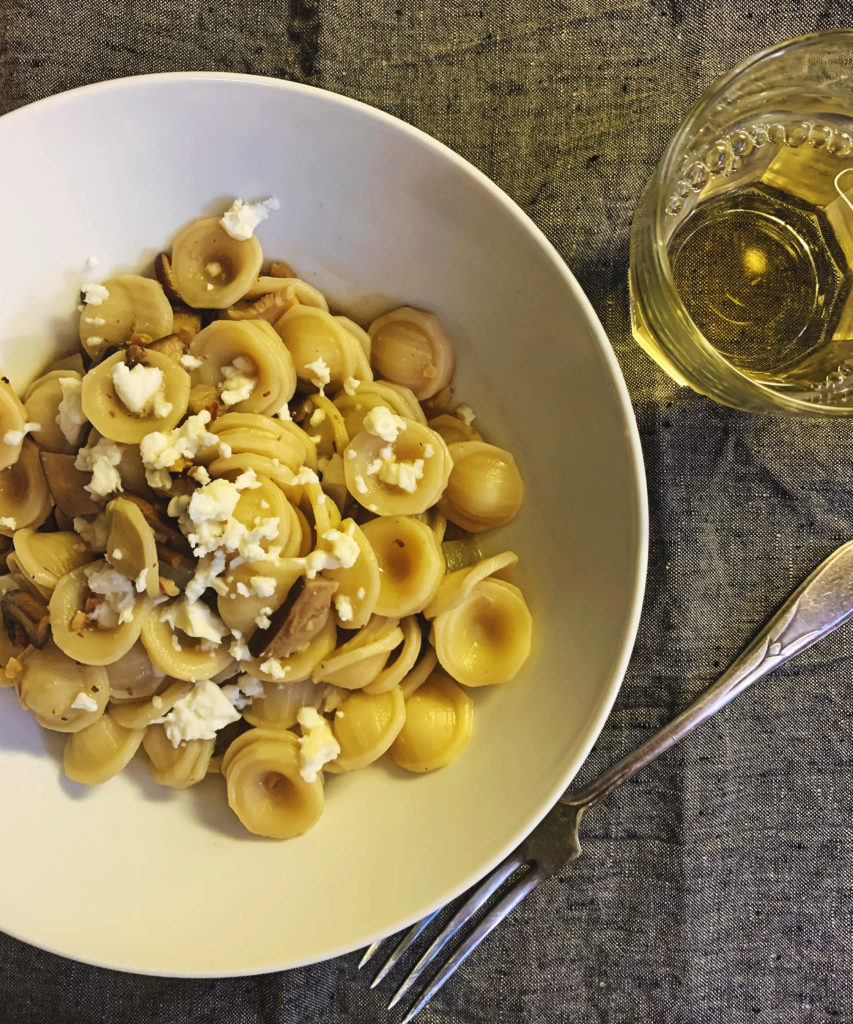 Pasta Mushroom Picada and a glass of white wine