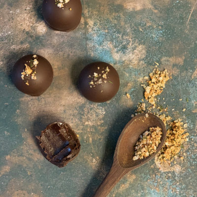 Round Burnt Caramel Dark Chocolate Truffles with raw sugar, seasonal herbed sea salt, and ganache