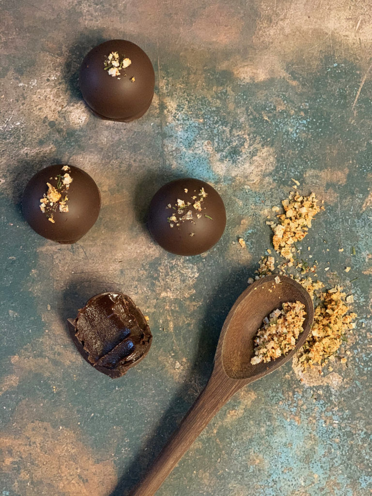 Round Burnt Caramel Dark Chocolate Truffles with raw sugar, seasonal herbed sea salt, and ganache