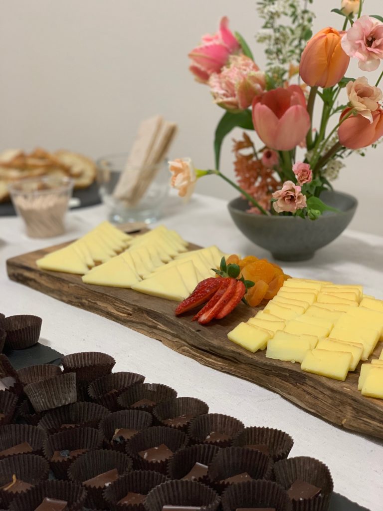 Table with a cheese board and Tavernier Chocolates bonbons