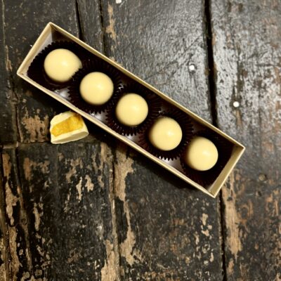 Box of white chocolate Sun's Return Cardamom Tumeric Bonbons